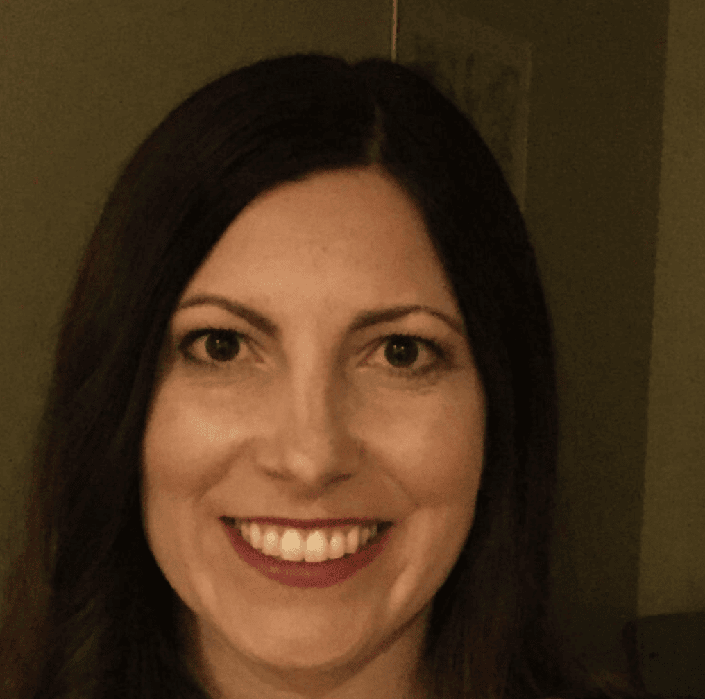Portrait of Kari Samuels, an intuitive counselor and numerologist, smiling warmly.