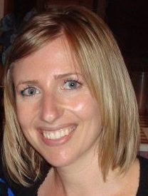 Portrait of Kari Samuels smiling, showcasing her warm and approachable demeanor.