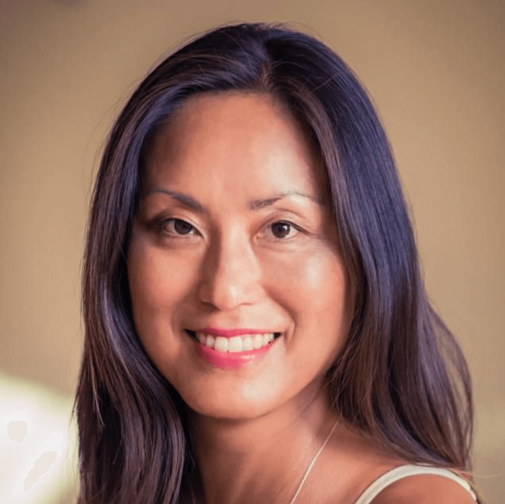 Portrait of Kari Samuels, an intuitive counselor and numerologist, smiling warmly.